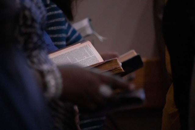 Photo of open bibles and phones at church